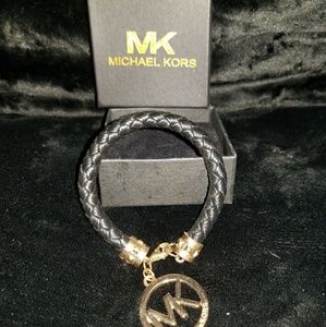 MK black braided bracelet with charm